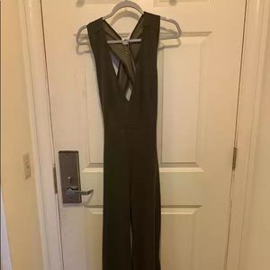 Olive green tailored jumpsuit with strappy details